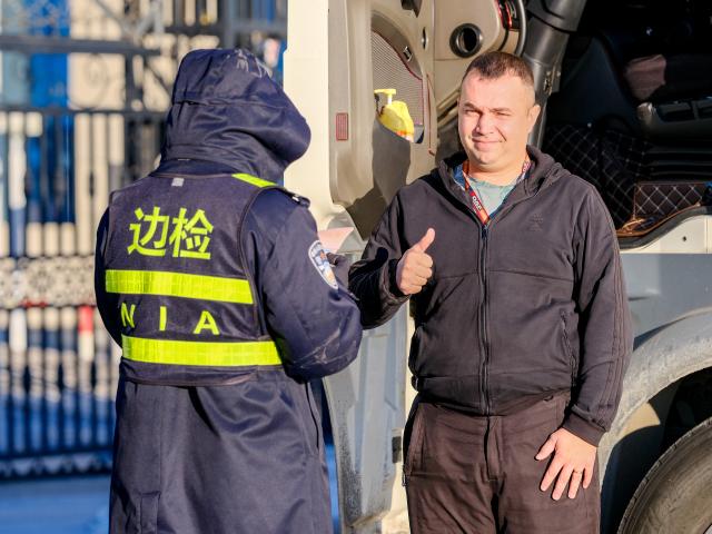 (251225) -- MANZHOULI, Dec. 25, 2025 (Xinhua) -- A Russian lorry driver goes through exit formalities at the Manzhouli land port in Manzhouli City, north China's Inner Mongolia Autonomous Region, Dec. 23, 2025. Manzhouli City, a historic port city on the China-Russia border, has been unleashing its vigor in city development with continuously deepening of opening-up. According to data released by the Manzhouli station of exit and entry frontier inspection, the Manzhouli port has handled over 900,000 inbound and outbound passenger trips this year as of Dec. 23. (Xinhua/Ma Jinrui)