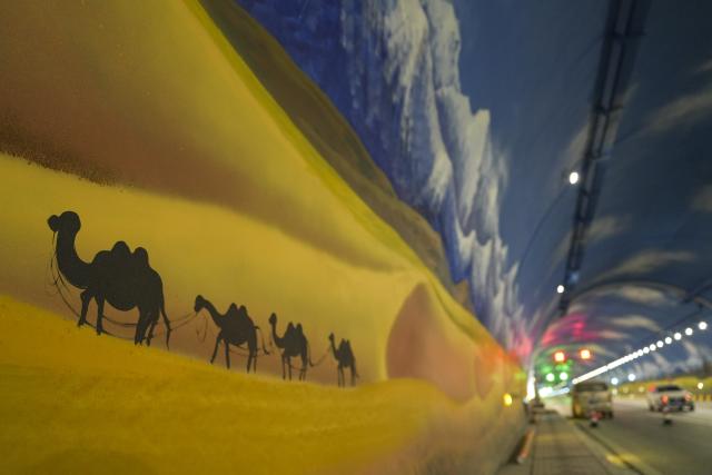 (251225) -- URUMQI, Dec. 25, 2025 (Xinhua) -- This photo taken on Dec. 20, 2025 shows a view of the Tianshan Shengli Tunnel on Urumqi-Yuli Expressway in northwest China's Xinjiang Uygur Autonomous Region. The Tianshan Shengli Tunnel, the world's longest expressway tunnel, and the Urumqi-Yuli Expressway that traverses the Tianshan Mountains via the tunnel, will be open to traffic by the end of this year, enabling a new shortcut linking southern and northern parts of Xinjiang.
  The 22.13-kilometer tunnel will reduce the time it takes to drive across the middle section of the Tianshan Mountains from several hours to about 20 minutes.
   Once operational, the travel time from the regional capital of Urumqi, north of the Tianshan Mountains, to Korla, south of the Tianshan Mountains, will be shortened from seven hours to about three hours. (Xinhua/Hu Huhu)