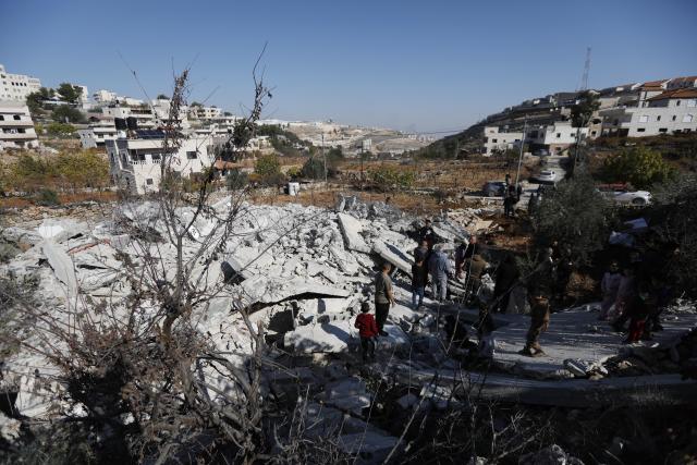 (251225) -- BETHLEHEM, Dec. 25, 2025 (Xinhua) -- Palestinians inspect a house demolished by Israeli forces in the village of Al-Khader, south of Bethlehem in the West Bank, Dec. 25, 2025. (Photo by Mamoun Wazwaz/Xinhua)