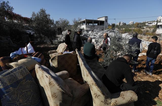 (251225) -- BETHLEHEM, Dec. 25, 2025 (Xinhua) -- Palestinians inspect a house demolished by Israeli forces in the village of Al-Khader, south of Bethlehem in the West Bank, Dec. 25, 2025. (Photo by Mamoun Wazwaz/Xinhua)