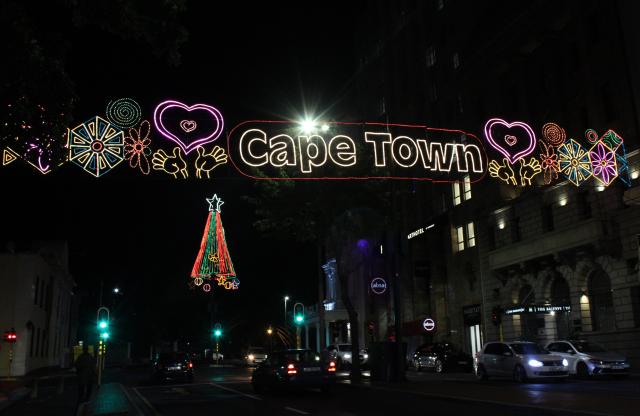 (251226) -- CAPE TOWN, Dec. 26, 2025 (Xinhua) -- This photo taken on Dec. 25, 2025 shows a street illuminated by festive lights in the city center of Cape Town, South Africa. Cape Town has been filled with festive atmosphere as the New Year approaches. (Photo by Shakirah Thebus/Xinhua)