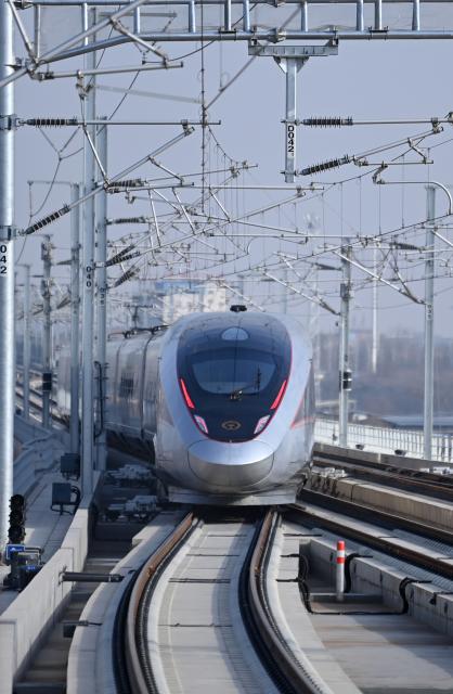 (251226) -- XI'AN, Dec. 26, 2025 (Xinhua) -- C9312, the first train of the Xi'an-Yan'an high-speed railway, departs from Fuping South Railway Station in northwest China's Shaanxi Province, on Dec. 26, 2025. A sleek silver bullet train departed Yan'an in northwest China's Shaanxi Province on Friday, linking the sacred revolutionary heartland to the country's rapidly expanding high-speed rail network.
   The newly opened 299-km line connects Yan'an with Xi'an, the provincial capital and home to the famed Terracotta Warriors, slashing travel time between the two cities from about 2.5 hours to roughly one hour.
   Designed for operations of up to 350 km per hour, the line marked the fastest train running on the Loess Plateau. (Xinhua/Li Yibo)