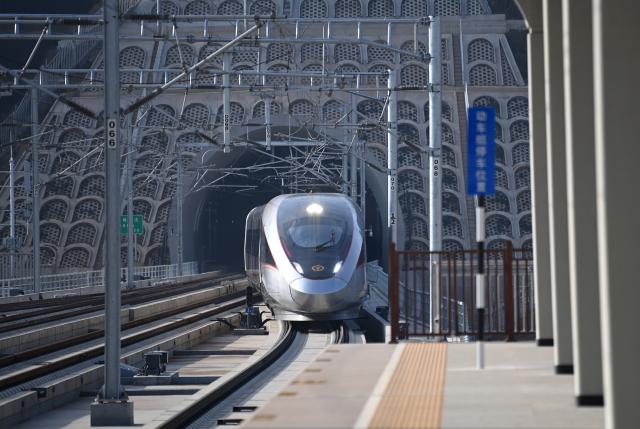 (251226) -- XI'AN, Dec. 26, 2025 (Xinhua) -- C9312, the first train of the Xi'an-Yan'an high-speed railway, arrives at Fuping South Railway Station in northwest China's Shaanxi Province, on Dec. 26, 2025. A sleek silver bullet train departed Yan'an in northwest China's Shaanxi Province on Friday, linking the sacred revolutionary heartland to the country's rapidly expanding high-speed rail network.
   The newly opened 299-km line connects Yan'an with Xi'an, the provincial capital and home to the famed Terracotta Warriors, slashing travel time between the two cities from about 2.5 hours to roughly one hour.
   Designed for operations of up to 350 km per hour, the line marked the fastest train running on the Loess Plateau. (Xinhua/Li Yibo)