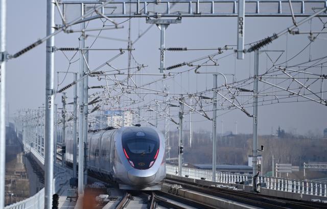 (251226) -- XI'AN, Dec. 26, 2025 (Xinhua) -- C9312, the first train of the Xi'an-Yan'an high-speed railway, departs from Fuping South Railway Station in northwest China's Shaanxi Province, on Dec. 26, 2025. A sleek silver bullet train departed Yan'an in northwest China's Shaanxi Province on Friday, linking the sacred revolutionary heartland to the country's rapidly expanding high-speed rail network.
   The newly opened 299-km line connects Yan'an with Xi'an, the provincial capital and home to the famed Terracotta Warriors, slashing travel time between the two cities from about 2.5 hours to roughly one hour.
   Designed for operations of up to 350 km per hour, the line marked the fastest train running on the Loess Plateau. (Xinhua/Li Yibo)