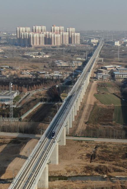 (251226) -- XI'AN, Dec. 26, 2025 (Xinhua) -- An aerial drone photo taken on Dec. 26, 2025 shows C9309, the first train of the Xi'an-Yan'an high-speed railway bound for Xi'an, running on the Fuping grand bridge in northwest China's Shaanxi Province. A sleek silver bullet train departed Yan'an in northwest China's Shaanxi Province on Friday, linking the sacred revolutionary heartland to the country's rapidly expanding high-speed rail network.
   The newly opened 299-km line connects Yan'an with Xi'an, the provincial capital and home to the famed Terracotta Warriors, slashing travel time between the two cities from about 2.5 hours to roughly one hour.
   Designed for operations of up to 350 km per hour, the line marked the fastest train running on the Loess Plateau. (Xinhua/Li Yibo)