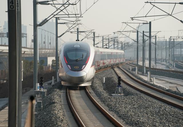 (251226) -- XI'AN, Dec. 26, 2025 (Xinhua) -- C9312, the first train of the Xi'an-Yan'an high-speed railway bound for Yan'an, departs from Xi'an North Railway Station in Xi'an, northwest China's Shaanxi Province, Dec. 26, 2025. A sleek silver bullet train departed Yan'an in northwest China's Shaanxi Province on Friday, linking the sacred revolutionary heartland to the country's rapidly expanding high-speed rail network.
   The newly opened 299-km line connects Yan'an with Xi'an, the provincial capital and home to the famed Terracotta Warriors, slashing travel time between the two cities from about 2.5 hours to roughly one hour.
   Designed for operations of up to 350 km per hour, the line marked the fastest train running on the Loess Plateau. (Xinhua/Shao Rui)
