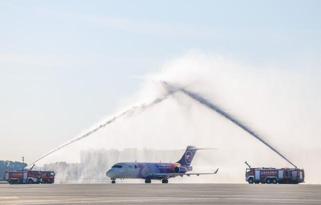 (251226) -- JIAXING, Dec. 26, 2025 (Xinhua) -- A cargo plane is welcomed by a water cannon salute upon arrival at Jiaxing Nanhu Airport in Jiaxing, east China's Zhejiang Province, on Dec. 26, 2025. Jiaxing Nanhu Airport, the first specialized air cargo hub in the Yangtze River Delta, was officially put into operation on Friday. The 4E-level airport is capable of handling both passenger and cargo planes with a focus on freight services. (Xinhua/Xu Yu)