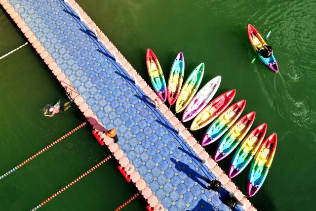 (251226) -- NANJIAN, Dec. 26, 2025 (Xinhua) -- A drone photo taken on Dec. 25, 2025 shows a tourist enjoying kayaking at a water sports base on the Lancang River in Gonglang Town in Nanjian Yi Autonomous County, southwest China's Yunnan Province. In recent years, Gonglang Town, boasting an advantageous ecological environment and pleasant climate throughout the year, has actively revitalized the rural economy by developing water sports initiatives and promoting cultural tourism.
   The town has established competitive, training, and experiential settings for a diverse range of open-water sports, and has proactively sought to host sports events and training programs. Additionally, it provides a host of cultural and tourism services, including catering and travel photography. These concerted efforts have created employment opportunities and diversified income sources for local villagers. (Xinhua/Liu Lianfen)