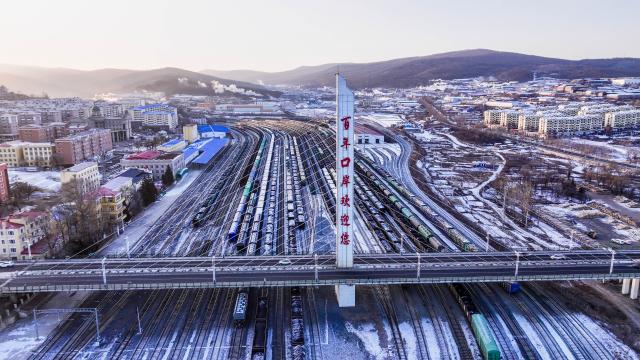 (251226) -- SUIFENHE, Dec. 26, 2025 (Xinhua) -- An aerial drone photo taken on Dec. 26, 2025 shows the China-Europe freight trains at the south yard of Suifenhe Railway Station in Suifenhe, northeast China's Heilongjiang Province. As a vital part of the eastern corridor of the China-Europe freight train network, the Suifenhe Railway Port has handled more than 4,000 China-Europe freight train trips since its launch in 2018, carrying over 390,000 TEUs of cargo, according to data from China Railway Harbin Group Co., Ltd. (Photo by Qu Yiwei/Xinhua)