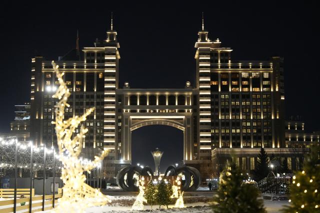 (251226) -- ASTANA, Dec. 26, 2025 (Xinhua) -- New Year-themed decorations are displayed in front of a landmark building in Astana, Kazakhstan, Dec. 25, 2025. Astana has been adorned in festive decorations recently as the New Year approaches. (Photo by Kalizhan Ospanov/Xinhua)