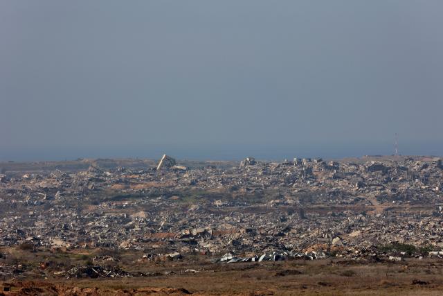 (251226) -- SDEROT, Dec. 26, 2025 (Xinhua) -- This photo taken on Dec. 25, 2025 shows destroyed buildings in the Gaza Strip as seen from Israel's southern border with the Gaza Strip. (Photo by Gil Cohen Magen/Xinhua)