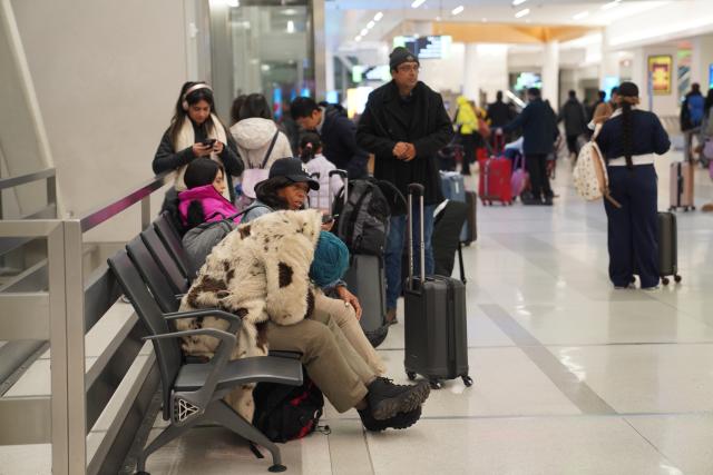 (251227) -- NEW YORK, Dec. 27, 2025 (Xinhua) -- Stranded passengers are seen at LaGuardia Airport in New York, the United States, on Dec. 26, 2025. A snowstorm hitting New York on Friday, which has caused flight delays and cancellations. (Xinhua/Zhang Fengguo)