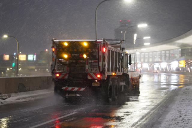 (251227) -- NEW YORK, Dec. 27, 2025 (Xinhua) -- A snowplow clears snow at LaGuardia Airport in New York, the United States, on Dec. 26, 2025. A snowstorm hitting New York on Friday, which has caused flight delays and cancellations. (Xinhua/Zhang Fengguo)