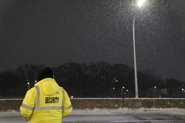 (251227) -- NEW YORK, Dec. 27, 2025 (Xinhua) -- A security personnel is seen in snow at LaGuardia Airport in New York, the United States, on Dec. 26, 2025. A snowstorm hitting New York on Friday, which has caused flight delays and cancellations. (Xinhua/Zhang Fengguo)