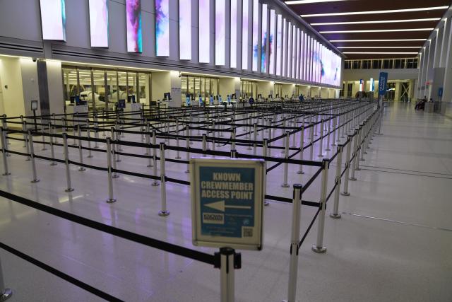 (251227) -- NEW YORK, Dec. 27, 2025 (Xinhua) -- This photo taken on Dec. 26, 2025 shows an empty check in area at LaGuardia Airport in New York, the United States. A snowstorm hitting New York on Friday, which has caused flight delays and cancellations. (Xinhua/Zhang Fengguo)