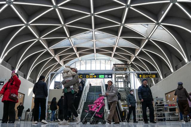 (251227) -- JINAN, Dec. 27, 2025 (Xinhua) -- Citizens enter the Quancheng Park Station of Jinan Subway Line 4, in Jinan, east China's Shandong Province, Dec. 27, 2025. China's first subway line passing through a karst spring area began operation on Saturday in Jinan, marking an engineering breakthrough that balances urban transit demands with the protection of natural water resources.
   Jinan Subway Line 8 and the east section of Jinan Subway Line 6 started operation on the same day, increasing the city's total rail transit mileage to 248 kilometers. (Xinhua/Zhu Zheng)