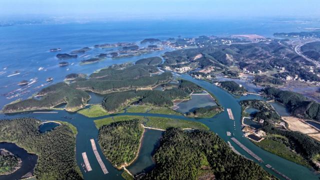 (251227) -- QINZHOU, Dec. 27, 2025 (Xinhua) -- An aerial drone photo taken on Dec. 27, 2025 shows the winter scenery of the Maowei Sea in Qinzhou, south China's Guangxi Zhuang Autonomous Region. In winter, the Maowei Sea in Guangxi presents picturesque scenery. In recent years, Guangxi has implemented high-standard ecological protection of the marine environment in the Beibu Gulf, transforming the Maowei Sea into a new cultural and tourism landmark. (Xinhua/Zhang Ailin)