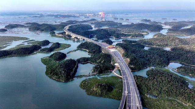 (251227) -- QINZHOU, Dec. 27, 2025 (Xinhua) -- An aerial drone photo taken on Dec. 27, 2025 shows the winter scenery of the Maowei Sea in Qinzhou, south China's Guangxi Zhuang Autonomous Region. In winter, the Maowei Sea in Guangxi presents picturesque scenery. In recent years, Guangxi has implemented high-standard ecological protection of the marine environment in the Beibu Gulf, transforming the Maowei Sea into a new cultural and tourism landmark. (Xinhua/Zhang Ailin)