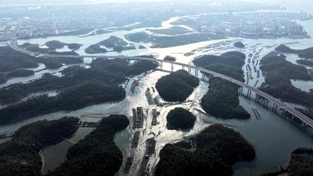 (251227) -- QINZHOU, Dec. 27, 2025 (Xinhua) -- An aerial drone photo taken on Dec. 27, 2025 shows the winter scenery of the Maowei Sea in Qinzhou, south China's Guangxi Zhuang Autonomous Region. In winter, the Maowei Sea in Guangxi presents picturesque scenery. In recent years, Guangxi has implemented high-standard ecological protection of the marine environment in the Beibu Gulf, transforming the Maowei Sea into a new cultural and tourism landmark. (Xinhua/Zhang Ailin)