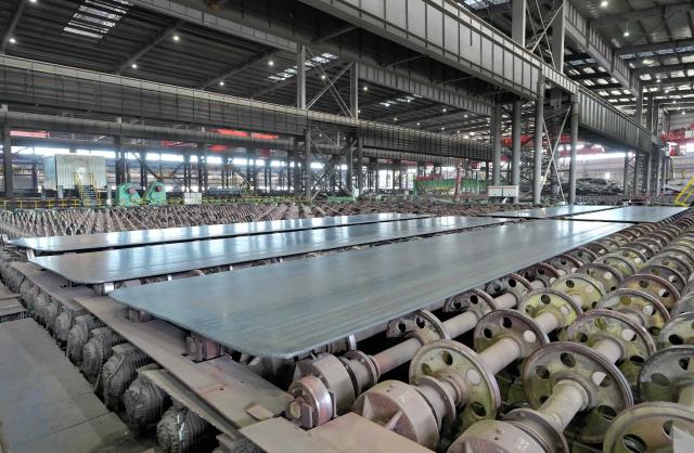 (251227) -- SHIJIAZHUANG, Dec. 27, 2025 (Xinhua) -- Steel plates are pictured on the production line of a shipbuilding steel enterprise in Tangshan Port economic development zone in Tangshan, north China's Hebei Province, Dec. 26, 2025. Leveraging its geographical advantages, the economic development zone has developed industries such as high-quality steel, equipment manufacturing, fine chemicals, high-end bathroom product and new energy to boost high-quality economic growth. (Xinhua/Yang Shiyao)