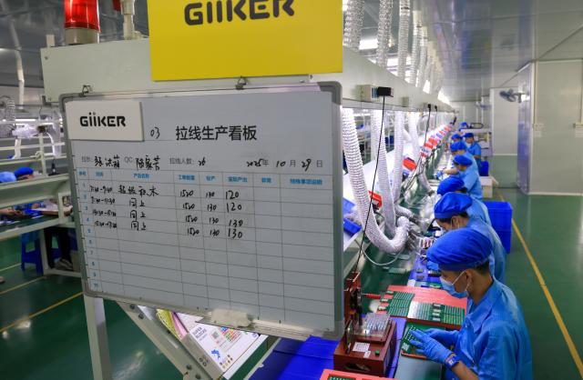 (251227) -- FOSHAN, Dec. 27, 2025 (Xinhua) -- Workers work on the production line of Giiker in Shunde, Foshan City, south China's Guangdong Province, Oct. 29, 2025. As traditional toys are stuck in price and homogenization competition, a batch of smart educational toys is quietly opening up new markets at home and abroad.
   In this emerging market segment, Giiker from Shunde of Foshan City, stands out. Founded in 2018, Giiker started with a Rubik's Cube product and has reached an annual gross merchandise volume of over 500 million yuan (about 71.36 million U.S. dollars) in just six years.
   Founder Su Ziming said that unlike the traditional toy industry's strategy of pursuing rapid launch and extensive distribution of new products, Giiker prefers to spend one to two years refining a product, emphasizing a long-term life cycle and high quality.
   Another outstanding company in this market segment is GANCUBE, a technology company also based in south China's Guangdong Province. It entered the market in 2014,  and has now developed into a smart competitive platform covering smart hardware, AI algorithms, and IoT ecosystem.  In the global smart competitive toy segment, GANCUBE holds approximately 20 percent of the market share. 
   Behind the rapid development lies its continuous R&D and manufacturing investment. GANCUBE has multiple production bases, including a digital factory of over 15,000 square meters. The team has a high proportion of R&D personnel, and it has even independently developed an automated cube production line that is rare in the industry. Its products are sold through platforms like Amazon and Tmall to over 100 countries and regions.
   The rise of smart educational toys reflects not only the upgrade of China's toy industry but also the evolution of educational concepts and consumption trends. As "learning through play" becomes a consensus, this market segment is attracting more and more innovators. (Xinhua/Mao Siqian)
