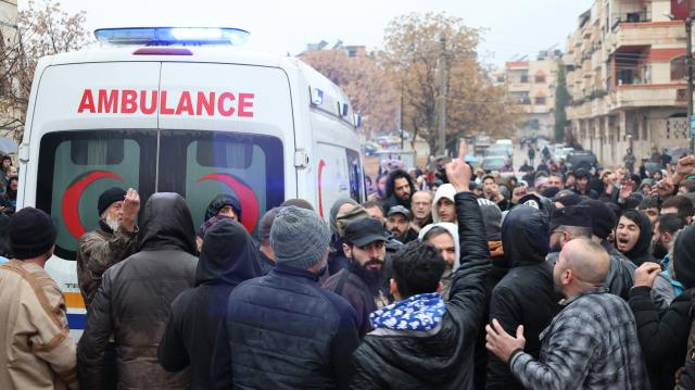 (251227) -- HOMS, Dec. 27, 2025 (Xinhua) -- Mourners gather outside the Imam Ali bin Abi Talib Mosque during a funeral procession for victims of a blast in Homs, central Syria, Dec. 27, 2025. An explosion struck the Imam Ali bin Abi Talib Mosque in the Wadi al-Dhahab neighborhood on Friday, killing eight people and leaving several others wounded. (Str/Xinhua)