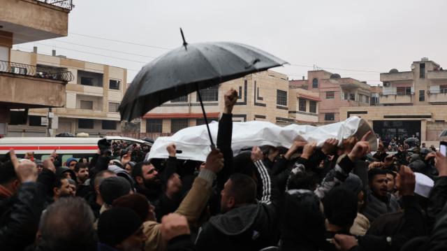 (251227) -- HOMS, Dec. 27, 2025 (Xinhua) -- Mourners gather outside the Imam Ali bin Abi Talib Mosque during a funeral procession for victims of a blast in Homs, central Syria, Dec. 27, 2025. An explosion struck the Imam Ali bin Abi Talib Mosque in the Wadi al-Dhahab neighborhood on Friday, killing eight people and leaving several others wounded. (Str/Xinhua)