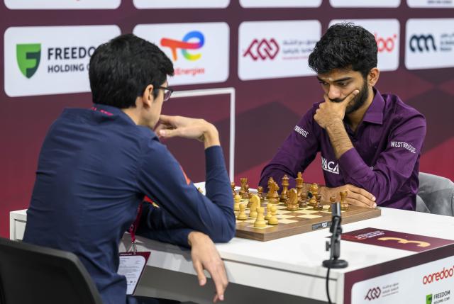 (251228) -- DOHA, Dec. 28, 2025 (Xinhua) -- Gukesh Dommaraju (R) of india competes during the Rapid Open sixth round against Anish Kumar Giri of Netherlands at the FIDE World Rapid & Blitz Championships 2025 in Doha, Qatar, on Dec. 27, 2025. (Photo by Nikku/Xinhua)