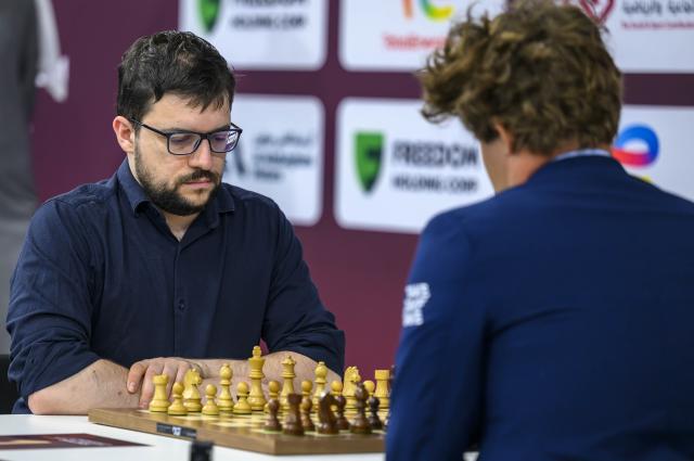 (251228) -- DOHA, Dec. 28, 2025 (Xinhua) -- Maxime Vachier-Lagrave (L) of India competes during the Rapid Open sixth round against Magnus Carlsen of Norway at the FIDE World Rapid & Blitz Championships 2025 in Doha, Qatar, on Dec. 27, 2025. (Photo by Nikku/Xinhua)