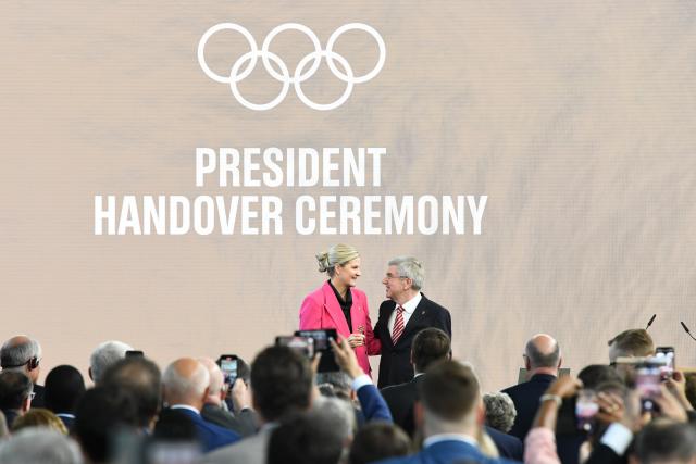 (251228) -- BEIJING, Dec. 28, 2025 (Xinhua) -- Here is Xinhua News Agency's selection of the 10 most significant pieces of international sports news in 2025: On March 20, Zimbabwe's former Olympic swimming champion Kirsty Coventry was elected the International Olympic Committee (IOC) president during the 144th IOC Session in Greece, becoming the organization's first female president and the first from outside Europe and North America.
After taking office in June, Coventry initiated a "Pause and Reflect" process and set up four working groups focusing on areas including the Youth Olympic Games and the Olympic program.
This file photo taken on June 23, 2025 shows IOC President Kirsty Coventry (L) receiving the key from outgoing IOC President Thomas Bach during a president handover ceremony at Olympic House in Lausanne, Switzerland. (Xinhua/Lian Yi)