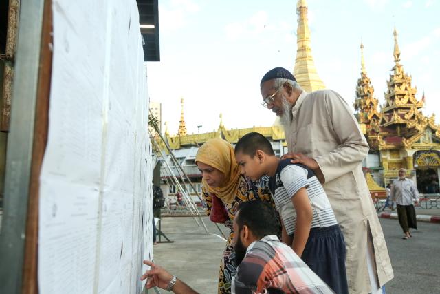 (251228) -- YANGON, Dec. 28, 2025 (Xinhua) -- Voters check information at a polling station in Yangon, Myanmar, Dec. 28, 2025.
  Myanmar kicked off its 2025 multi-party democratic general election with the first phase held on Sunday.
  The general election is scheduled to be held in three phases, with the second phase set for Jan. 11, 2026, followed by the third phase on Jan. 25. (Xinhua/Myo Kyaw Soe)
