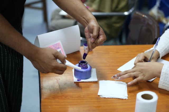 (251228) -- YANGON, Dec. 28, 2025 (Xinhua) -- A voter's finger is marked with ink at a polling station in Yangon, Myanmar, Dec. 28, 2025.
  Myanmar kicked off its 2025 multi-party democratic general election with the first phase held on Sunday.
  The general election is scheduled to be held in three phases, with the second phase set for Jan. 11, 2026, followed by the third phase on Jan. 25. (Xinhua/Myo Kyaw Soe)
