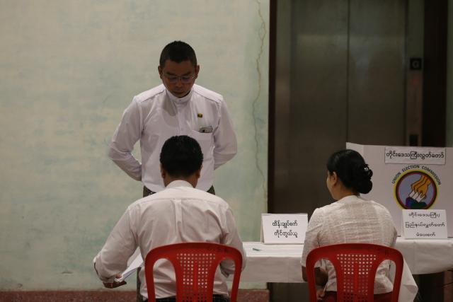 (251228) -- YANGON, Dec. 28, 2025 (Xinhua) -- A voter checks in at a polling station in Yangon, Myanmar, Dec. 28, 2025.
  Myanmar kicked off its 2025 multi-party democratic general election with the first phase held on Sunday.
  The general election is scheduled to be held in three phases, with the second phase set for Jan. 11, 2026, followed by the third phase on Jan. 25. (Xinhua/Myo Kyaw Soe)