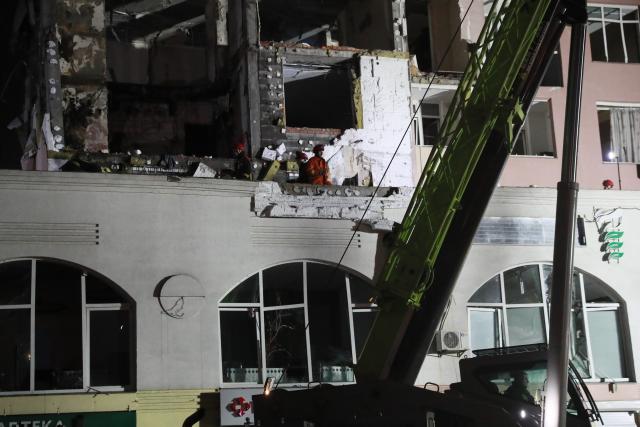 (251228) -- KIEV, Dec. 28, 2025 (Xinhua) -- Rescuers work at a damaged building in Kiev, capital of Ukraine, Dec. 27, 2025.
  At least two persons were killed and 46 others were injured in Russian strikes on the Ukrainian capital and its outskirts in the early hours of Saturday, local authorities said. (Xinhua/Li Dongxu)