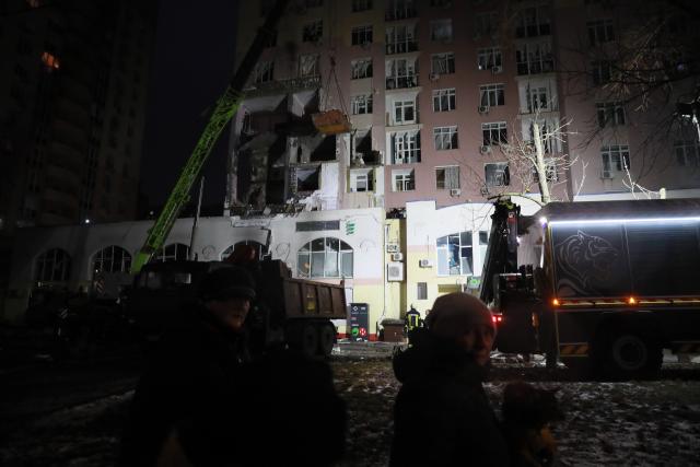 (251228) -- KIEV, Dec. 28, 2025 (Xinhua) -- Rescuers work at a damaged building in Kiev, capital of Ukraine, Dec. 27, 2025.
  At least two persons were killed and 46 others were injured in Russian strikes on the Ukrainian capital and its outskirts in the early hours of Saturday, local authorities said. (Xinhua/Li Dongxu)