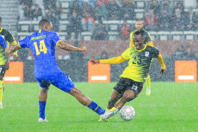 (251228) -- MOROCCO, Dec. 28, 2025 (Xinhua) -- Aziz Abdu Kayondo (R) of Uganda vies with Bakari Nondo of Tanzania during the group C match between Tanzania and Uganda at the Africa Cup of Nations 2025 in Rabat, Morocco, Dec. 27, 2025. (Photo by Hajarah Nalwadda/Xinhua)