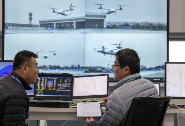 (251228) -- DEYANG, Dec. 28, 2025 (Xinhua) -- Technicians monitor the flight of a Lanying R6000 tiltrotor unmanned aerial vehicle (UAV) in Deyang City, southwest China's Sichuan Province, Dec. 28, 2025.
  The Lanying R6000, a 6-ton tiltrotor UAV developed by China's United Aircraft, completed its maiden flight here on Sunday, marking a new step in the country's ambitions in advanced vertical-lift aviation.
  The UAV has a payload capacity of up to 2,000 kg, with a maximum cruising speed of 550 km per hour and a range of about 4,000 km at altitudes up to 7,620 m. (Photo by Yin Gang/Xinhua)
