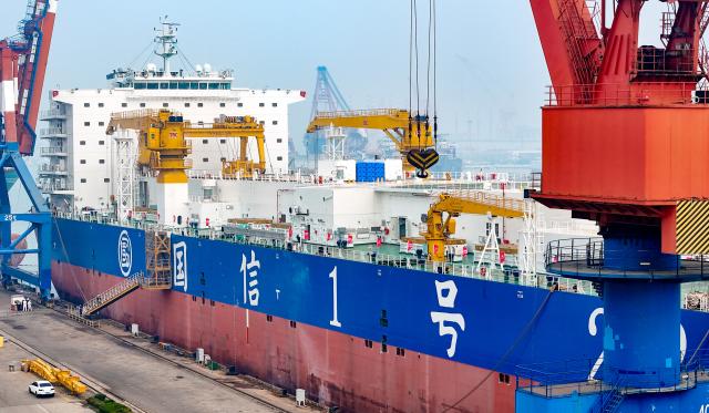 (251228) -- JINAN, Dec. 28, 2025 (Xinhua) -- A drone photo taken on Nov. 15, 2025 shows the delivery of a 150,000-ton class smart fishery breeding workboat at the Haixi Bay Shipbuilding and Marine Engineering Industrial Base in Qingdao, east China's Shandong Province. In recent years, Shandong has been committed to building a high-end industrial cluster integrating shipbuilding and marine engineering equipment in Shandong Peninsula, embarking on a high-quality development path driven by the marine economy. (Photo by Zhang Jingang/Xinhua)