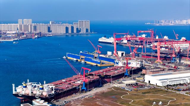 (251228) -- JINAN, Dec. 28, 2025 (Xinhua) -- An aerial drone photo taken on Dec. 24, 2025 shows the China State Shipbuilding Corporation Qingdao Beihai Shipbuilding Co., Ltd. conducting shipbuilding work at the Haixi Bay Shipbuilding and Marine Engineering Industrial Base in Qingdao, east China's Shandong Province. In recent years, Shandong has been committed to building a high-end industrial cluster integrating shipbuilding and marine engineering equipment in Shandong Peninsula, embarking on a high-quality development path driven by the marine economy. (Xinhua/Guo Xulei)