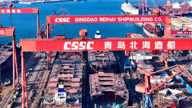 (251228) -- JINAN, Dec. 28, 2025 (Xinhua) -- An aerial drone photo taken on Dec. 24, 2025 shows the China State Shipbuilding Corporation Qingdao Beihai Shipbuilding Co., Ltd. conducting shipbuilding work at the Haixi Bay Shipbuilding and Marine Engineering Industrial Base in Qingdao, east China's Shandong Province. In recent years, Shandong has been committed to building a high-end industrial cluster integrating shipbuilding and marine engineering equipment in Shandong Peninsula, embarking on a high-quality development path driven by the marine economy. (Xinhua/Guo Xulei)