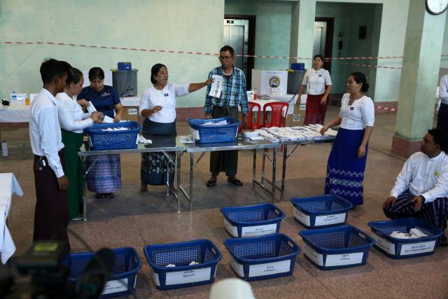 (251228) -- YANGON, Dec. 28, 2025 (Xinhua) -- Officials of the Union Election Commission count votes during the general election at a polling station in Yangon, Myanmar, Dec. 28, 2025. Myanmar kicked off its 2025 multi-party democratic general election with the first phase held on Sunday.
  The general election is scheduled to be held in three phases, with the second phase set for Jan. 11, 2026, followed by the third phase on Jan. 25. (Xinhua/Myo Kyaw Soe)