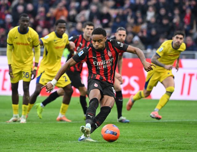 (251229) -- MILAN, Dec. 29, 2025 (Xinhua) -- AC Milan's Christopher Nkunku (front) scores a penalty goal during a Serie A football match between AC Milan and Hellas Verona in Milan, Italy, Dec. 28, 2025. (Photo by Alberto Lingria/Xinhua)