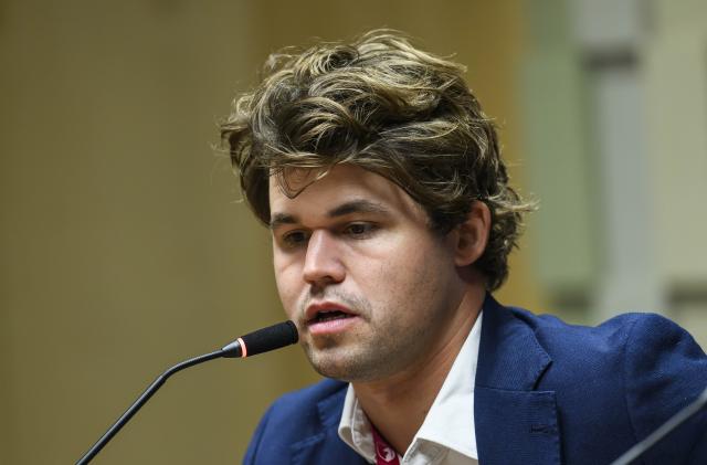 (251229) -- DOHA, Dec. 29, 2025 (Xinhua) -- Magnus Carlsen of Norway attends a press conference after winning the men's rapid title at the FIDE World Rapid & Blitz Championships 2025 in Doha, Qatar, Dec. 28, 2025. (Photo by Nikku/Xinhua)