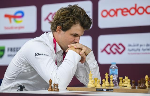 (251229) -- DOHA, Dec. 29, 2025 (Xinhua) -- Magnus Carlsen of Norway competes during the Rapid Open final round against Anish Giri of the Netherlands at the FIDE World Rapid & Blitz Championships 2025 in Doha, Qatar, Dec. 28, 2025. (Photo by Nikku/Xinhua)