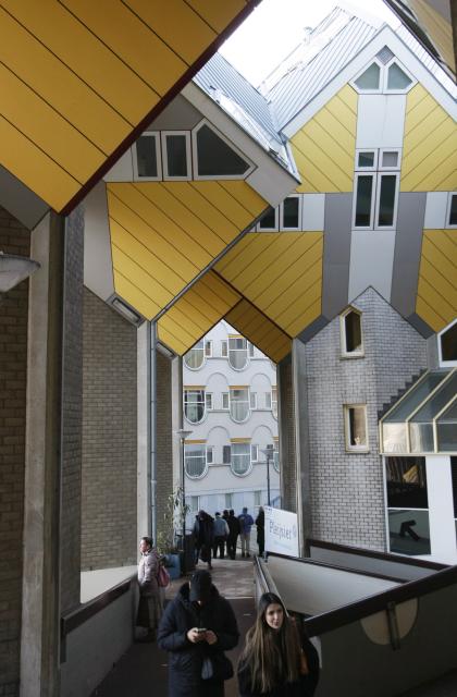 (251229) -- ROTTERDAM, Dec. 29, 2025 (Xinhua) -- This photo taken on Dec. 28, 2025 shows the cube houses in Rotterdam, the Netherlands. The cube houses, designed by Dutch architect Piet Blom, were built in the 1980s. A total of 38 cube houses resemble an interconnected "Rubik's Cube" and have become a distinctive architectural landmark in Rotterdam. (Xinhua/Shao Haijun)