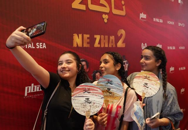 (251229) -- BEIJING, Dec. 29, 2025 (Xinhua) -- Girls take a selfie in front of a promotional display for the premiere of Chinese animated blockbuster "Ne Zha 2" in Riyadh, Saudi Arabia on June 25, 2025. Top 10 China news events of 2025
  2. "Ne Zha 2" tops global animation box office
  The global earnings of Chinese animated powerhouse "Ne Zha 2" exceeded 15 billion yuan (about 2.14 billion U.S. dollars) on March 14, making it the highest-grossing animated movie of all time worldwide.
  The milestone marks a historic breakthrough for Chinese cinema and forms part of a broader wave of cultural moments over the past year that have reinforced China's growing cultural presence on the global stage. (Xinhua/Luo Chen)