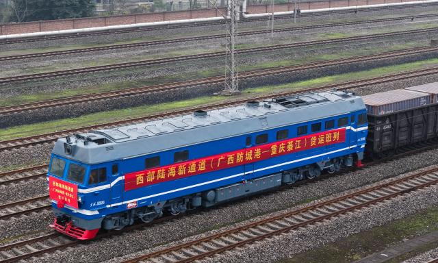 (251229) -- CHONGQING, Dec. 29, 2025 (Xinhua) -- An aerial drone photo taken on Dec. 29, 2025 shows the first freight train from Fangchenggang City of Guangxi to Qijiang District of Chongqing arriving at the Qijiang North railway station in southwest China's Chongqing Municipality. The first freight train of the Guangxi Fangchenggang-Chongqing Qijiang railway, part of China's New International Land-Sea Trade Corridor rail service which is a crucial logistics link between China's western inland regions and global markets, arrived at the Qijiang North railway station in Chongqing on Monday. (Xinhua/Chen Cheng)