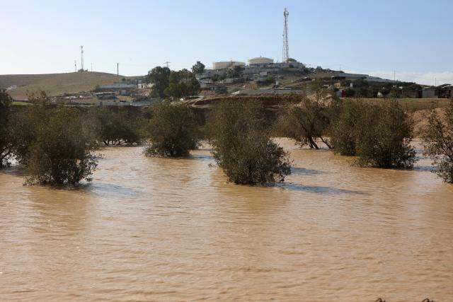 (251229) -- NEGEV, Dec. 29, 2025 (Xinhua) -- This photo taken on Dec. 28, 2025 shows trees submerged in floodwater in southern Israel. Israel's winter rainy season frequently brings floods. (Photo by Gil Cohen Magen/Xinhua)