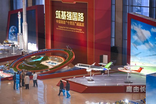 (251229) -- BEIJING, Dec. 29, 2025 (Xinhua) -- This photo taken on Dec. 29, 2025 shows a view of the exhibition "Forging the Path to National Strength: China's Manufacturing Achievements under the 14th Five-Year Plan" at the National Museum of China in Beijing, capital of China. With more than 300 pieces (sets) exhibits, the exhibition kicked off here on Monday, showcasing China's manufacturing achievements under the 14th Five-Year Plan. (Xinhua/Jin Liangkuai)