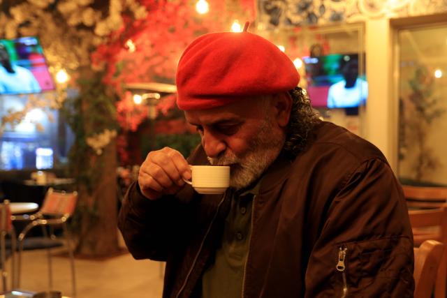 (251229) -- AMMAN, Dec. 29, 2025 (Xinhua) -- A man drinks coffee at a cafe in Amman, Jordan, Dec. 24, 2025. TO GO with "Feature: From social occasions to daily habits, coffee craze reveals changing Jordanian lifestyle" (Photo by Mohammad Abu Ghosh/Xinhua)